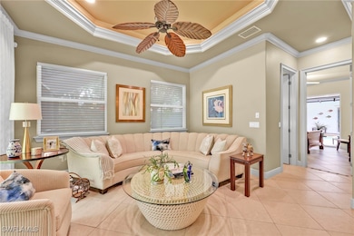 Living area with light tile patterned floors, a ce