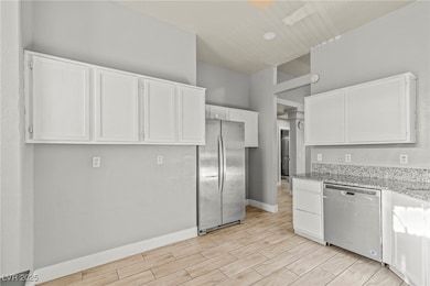 Kitchen featuring stainless steel appliances, whit