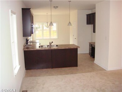 Kitchen -  Pictures are of a similar home and may 
