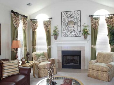 Vaulted ceilings and gas fire place make the room 