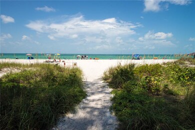 The path to the sugar sand beach is across the str