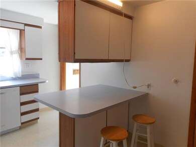 Peninsula in kitchen with storage above and below