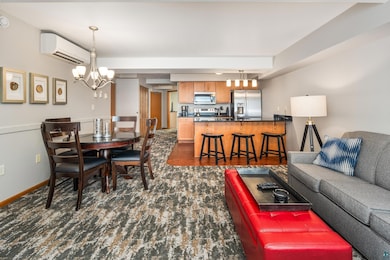 Living room with dark hardwood / wood-style floors