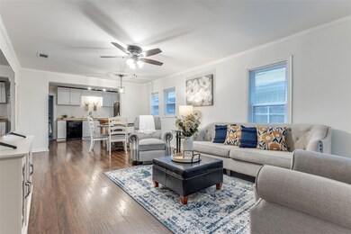 Living room with dark hardwood / wood-style floors