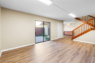 Unfurnished living room with ceiling fan, light ha