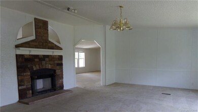 Living room looking from front entry with fireplac