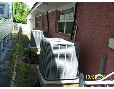 Yard. Side yard and New A/C units