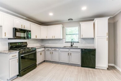 The kitchen features new granite counter tops, gold hardware, honeycomb backsplash, and refinished cabinetry.