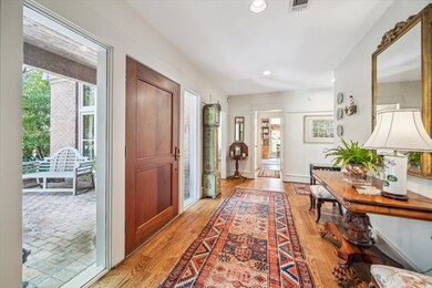 Entry with full light windows on both sides of the