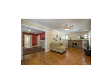 Formal dining room between living room and kitchen