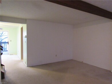 Large living room with beam ceiling