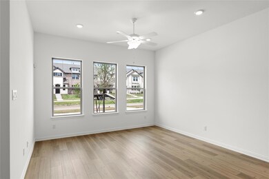 Spare room featuring ceiling fan and light hardwood / wood-style flooring