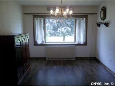 Exterior Front The dining room has wood floors, a 