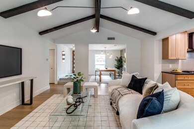 Living room featuring light wood-type flooring, a