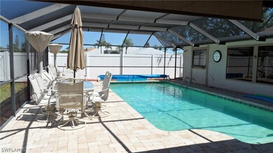 Pavered pool deck and mansard screen enclosure