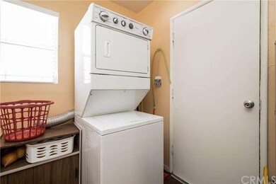 In home laundry room.  Water softener and washer a