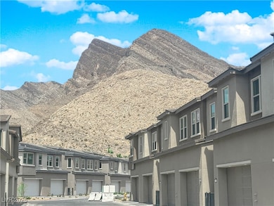 View of mountain background featuring nearby suburban area