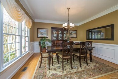 Dining room features elaborate crown, shadow box, 