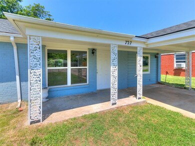 View of exterior entry featuring a yard