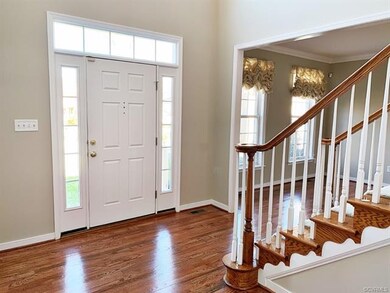 Enter through the Front Storm Door with Sidelights