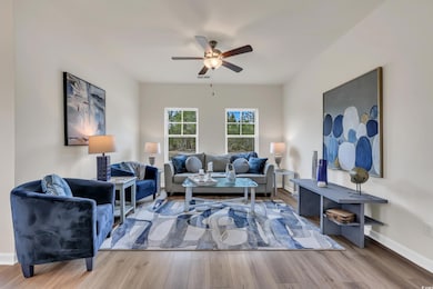 Living room featuring baseboards, visible vents, w