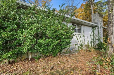 View of property exterior featuring a chimney