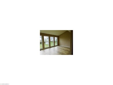 morning room with vinyl flooring leads to backyard