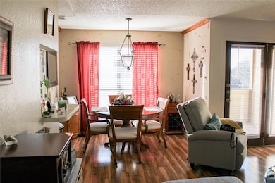 Dining room and living room with door to the balco