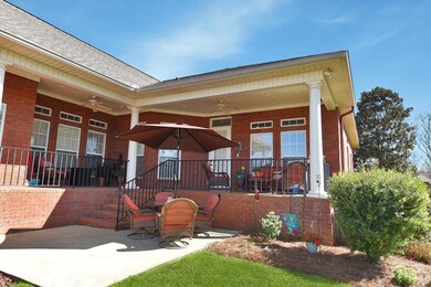 Wrap Around Patio w/wrought iron railing