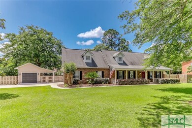 Beautiful front exterior! Mature landscaping, huge porch & shady trees!