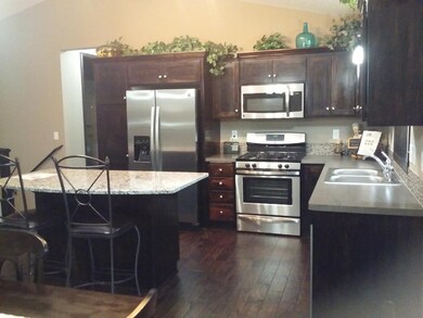 Photo of a similar home.  Finishes will be similar