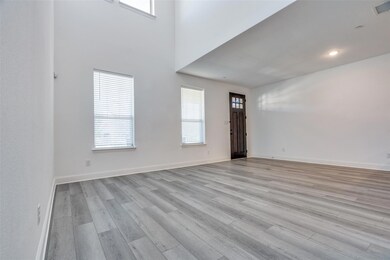 Foyer is open to the kitchen, dining, and living r