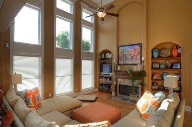 This photograph shows the built-in bookcases that flank the marble fireplace in the den.