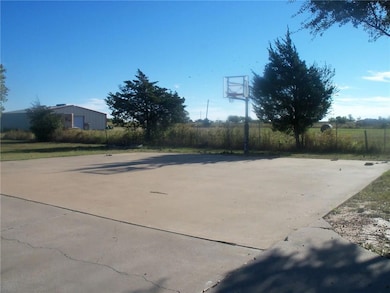 View of patio / terrace featuring basketball hoop