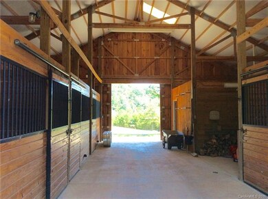 Barn with Concrete Center Aisle, 8' Open Sheds on 