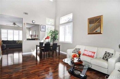 Formal Living & Dining Rooms with Soaring Ceiling & Beautiful Wood Laminate Flooring