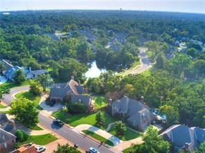 Aerial view of property's location featuring nearby suburban area