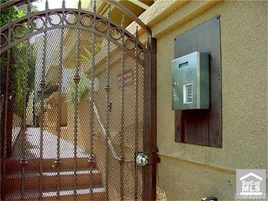 Gated entrance with intercom system provides added