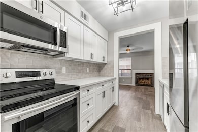 Kitchen featuring appliances with stainless steel