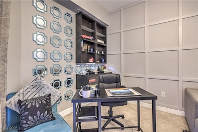 Office with light tile patterned floors, a decorat