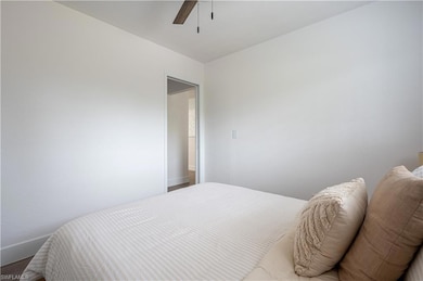 Bedroom with wood-type flooring and ceiling fan