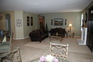 Family room view from Kitchen with a Great firepla