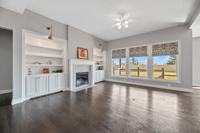 Beautiful wood flooring and showcase built ins