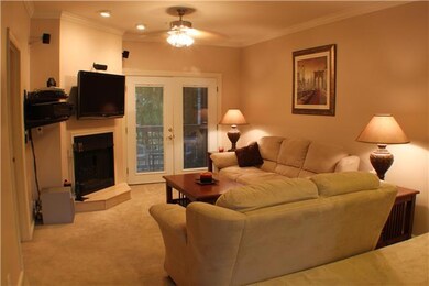 French doors lead to the balcony.  Balcony has a closet for extra storage. 