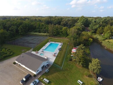 In-ground pool, club house, tennis courts and boat