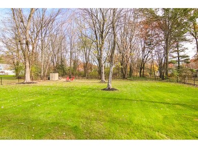 From back deck looking at fully fenced and wooded 