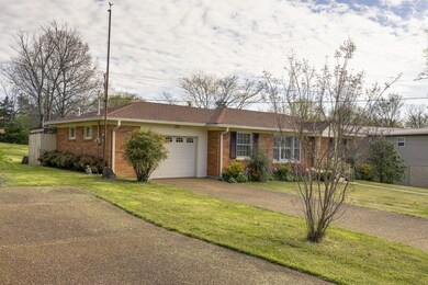 ONE CAR ATTACHED GARAGE WITH AGGREGATE DRIVEWAY AND PARKING PAD