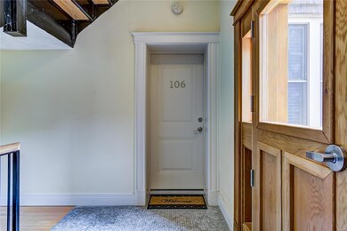 Enter unit 106 from the main door to the right.