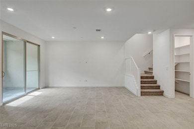 Below grade area with stairs and recessed lighting