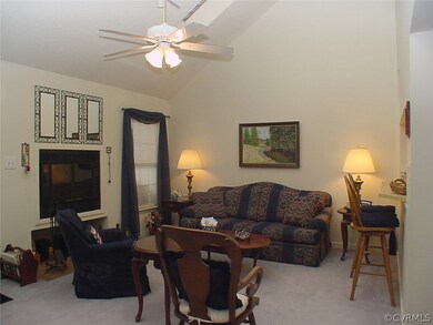 Greatroom with fireplace, skylights and ceiling.
